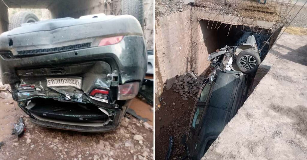 The jeep compass falls 20 feet below the road